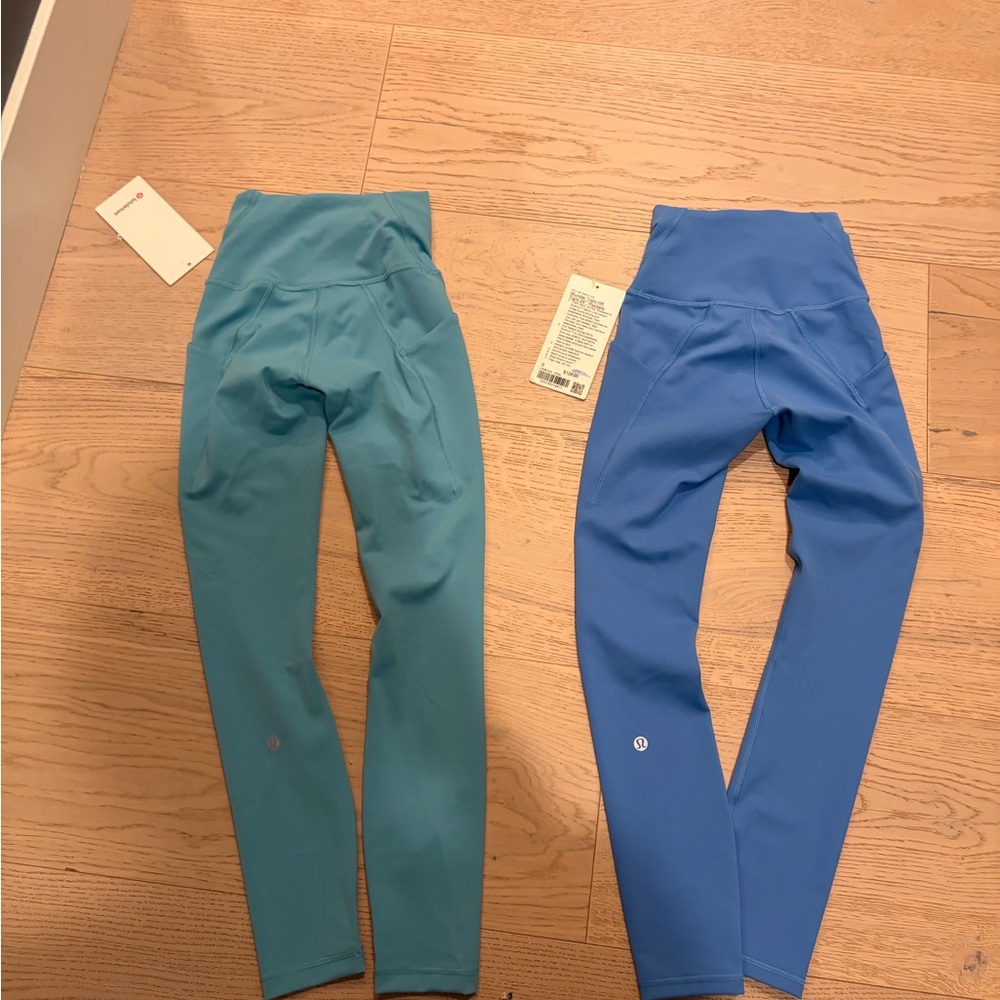 Blue and Teal Lululemon wunder train HR tight 25” pockets